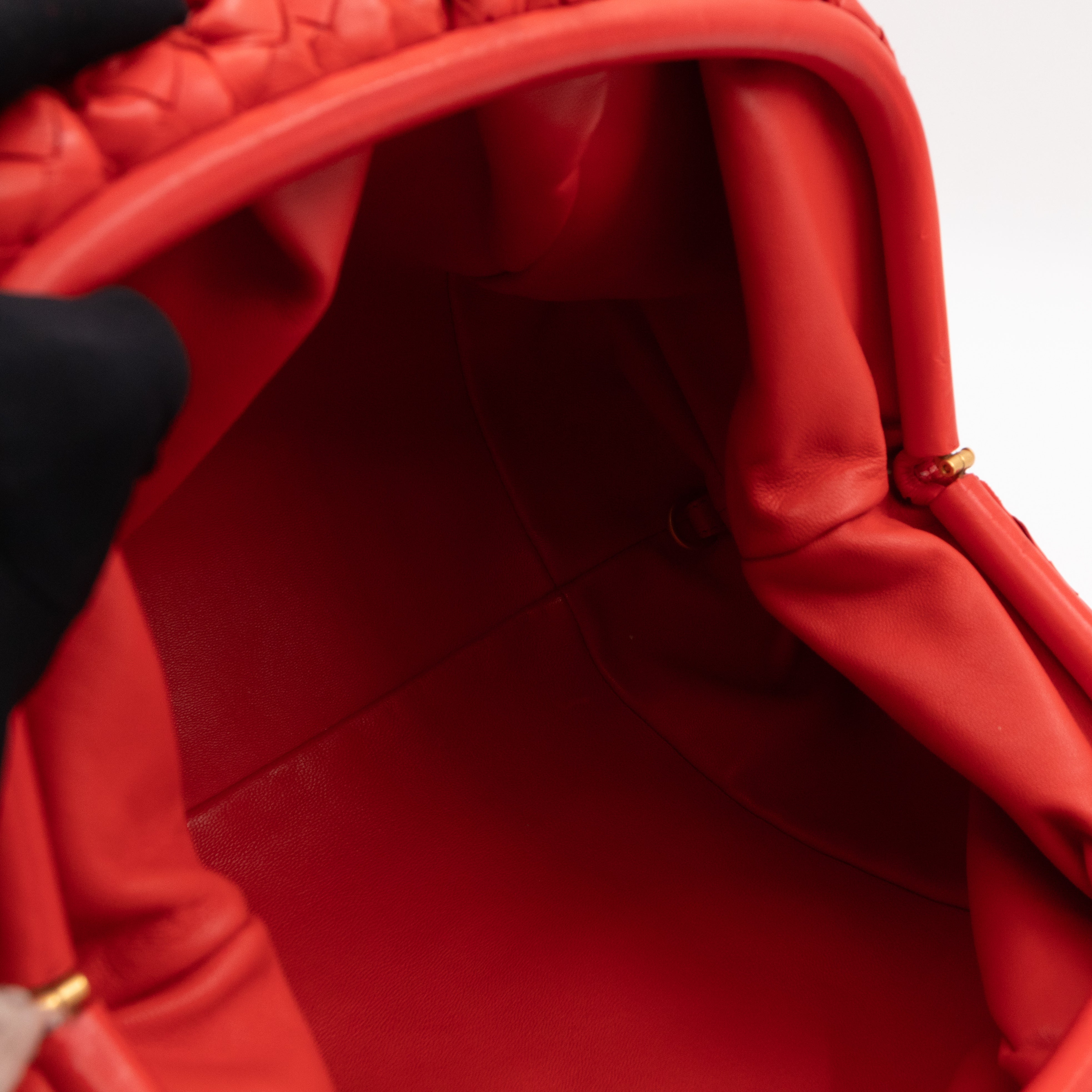 The Pouch Clutch Intrecciato Leather Coral