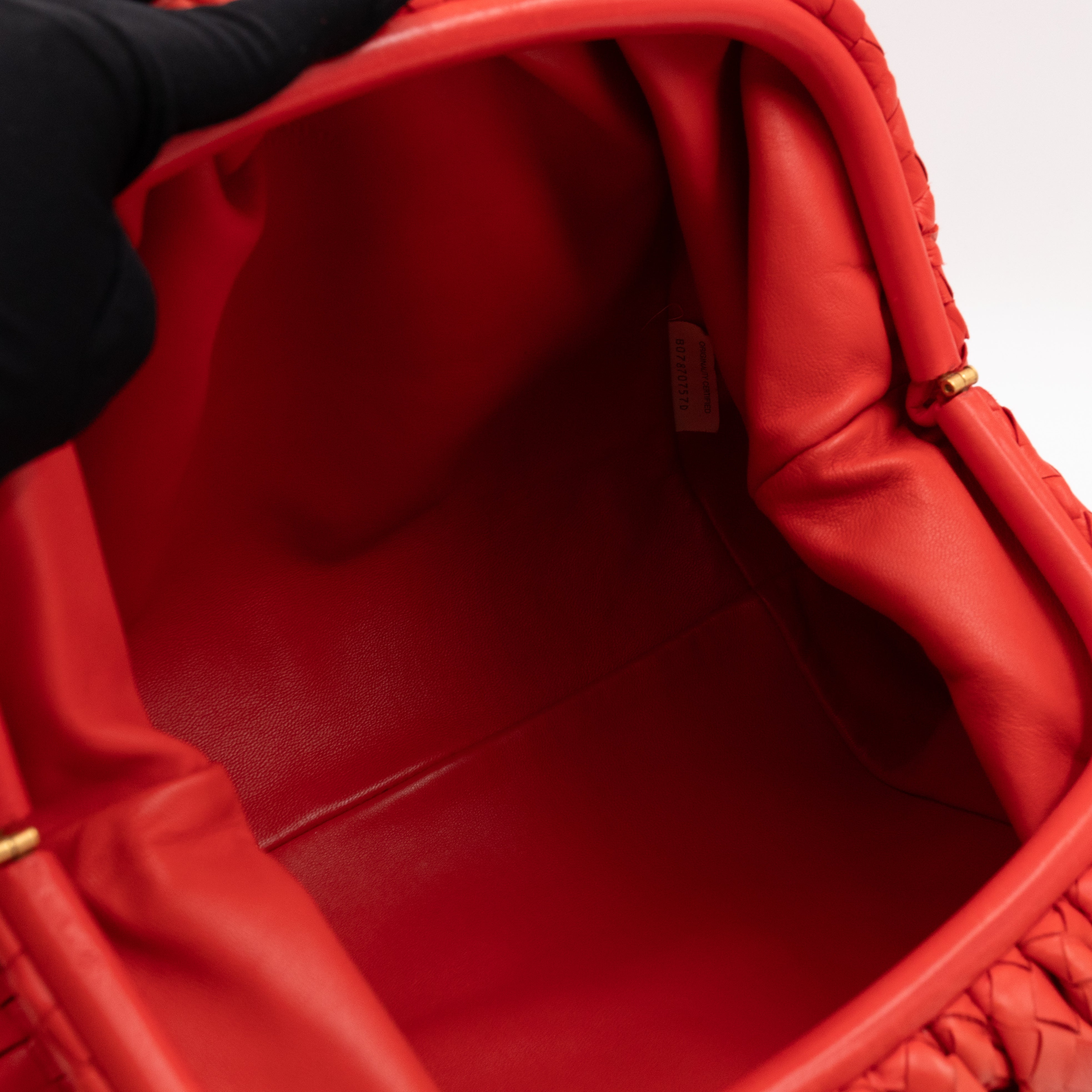 The Pouch Clutch Intrecciato Leather Coral