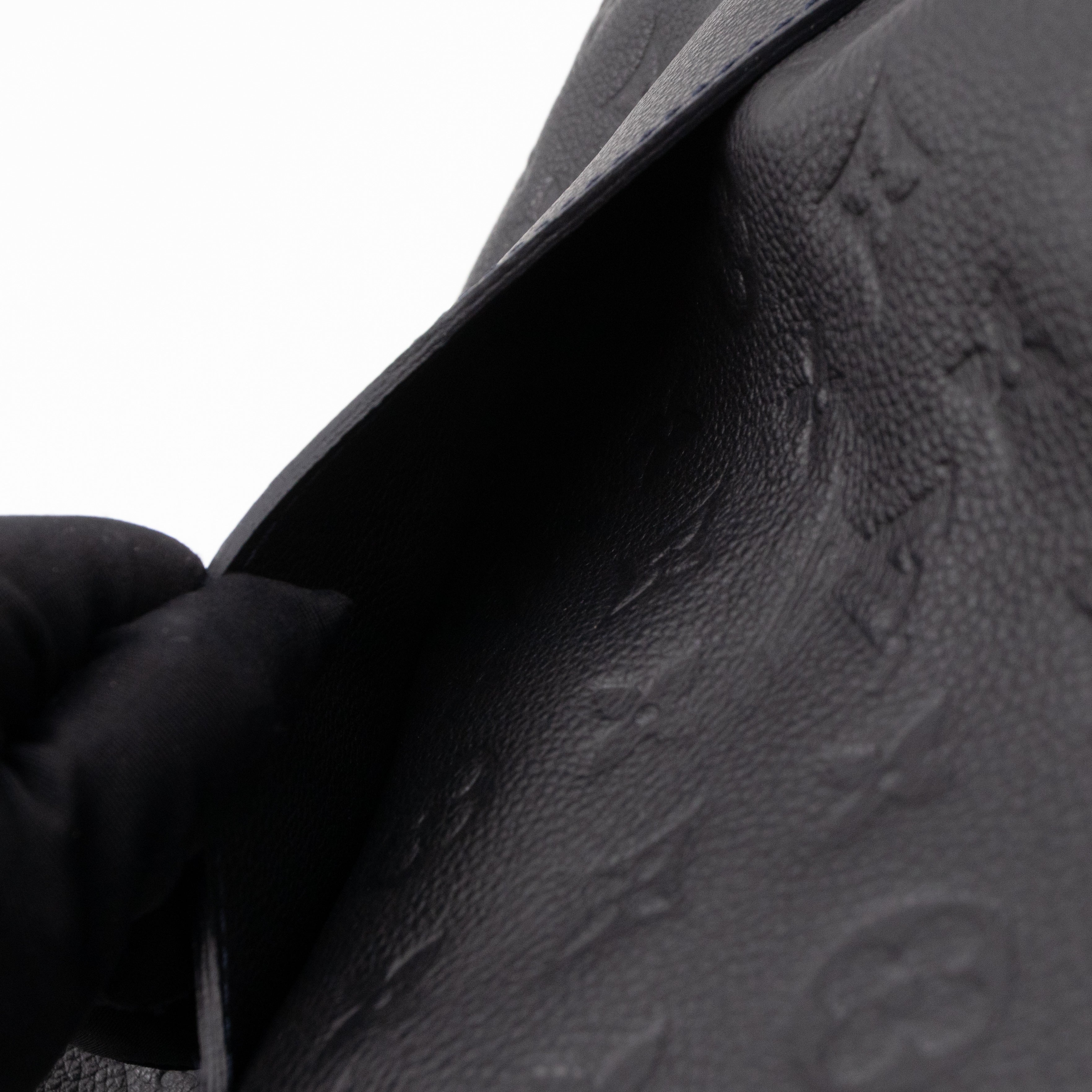 Petillante Clutch Bleu Infini Monogram Empreinte