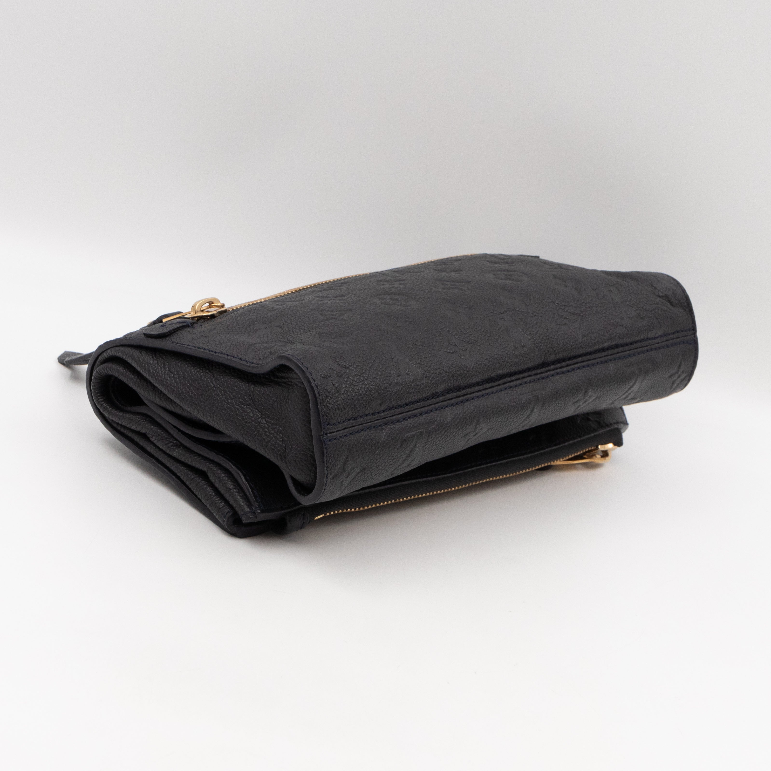 Petillante Clutch Bleu Infini Monogram Empreinte