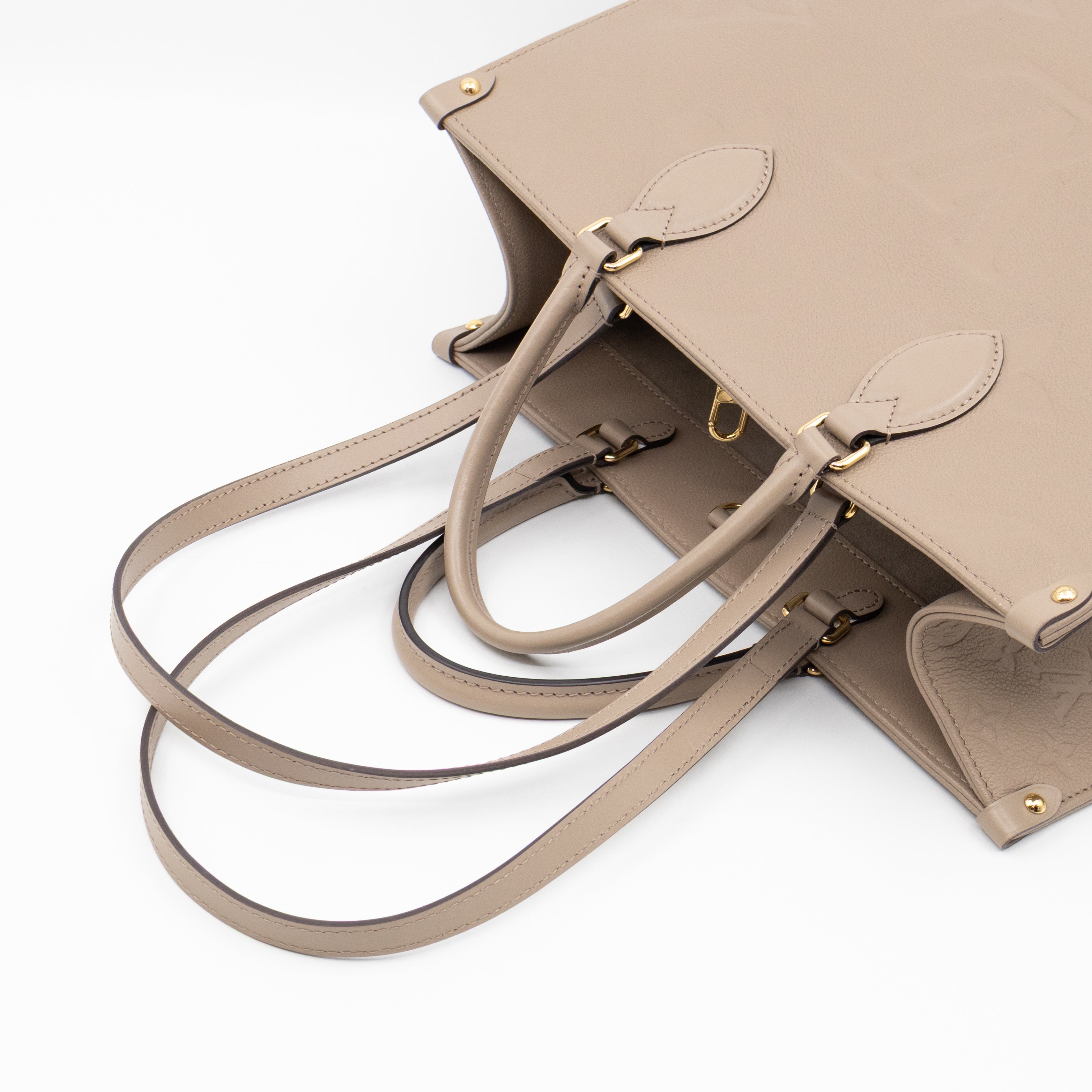 Onthego MM Dune Monogram Empreinte