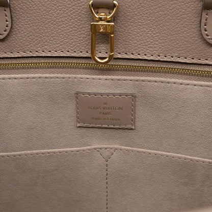 Onthego MM Dune Monogram Empreinte
