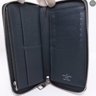 Zippy Vertical Monogram Cobalt Stripe Wallet