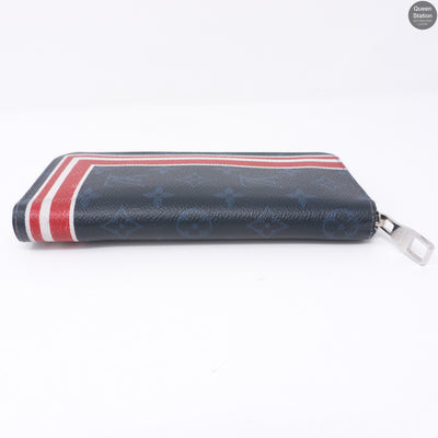 Zippy Vertical Monogram Cobalt Stripe Wallet