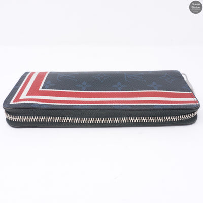 Zippy Vertical Monogram Cobalt Stripe Wallet