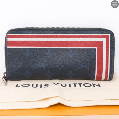 Zippy Vertical Monogram Cobalt Stripe Wallet