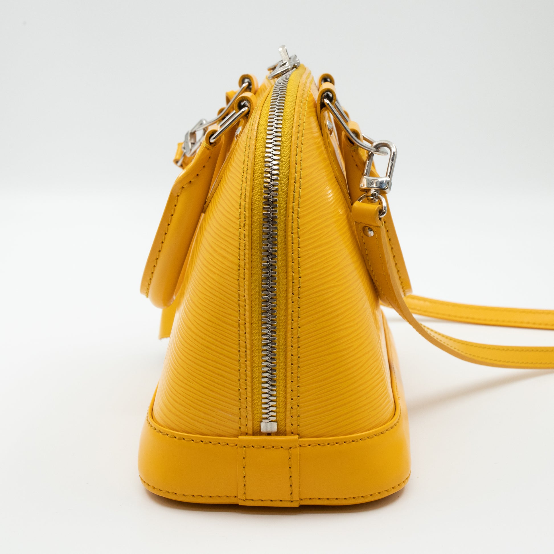 Alma bb leather handbag Louis Vuitton Yellow in Leather - 15674263
