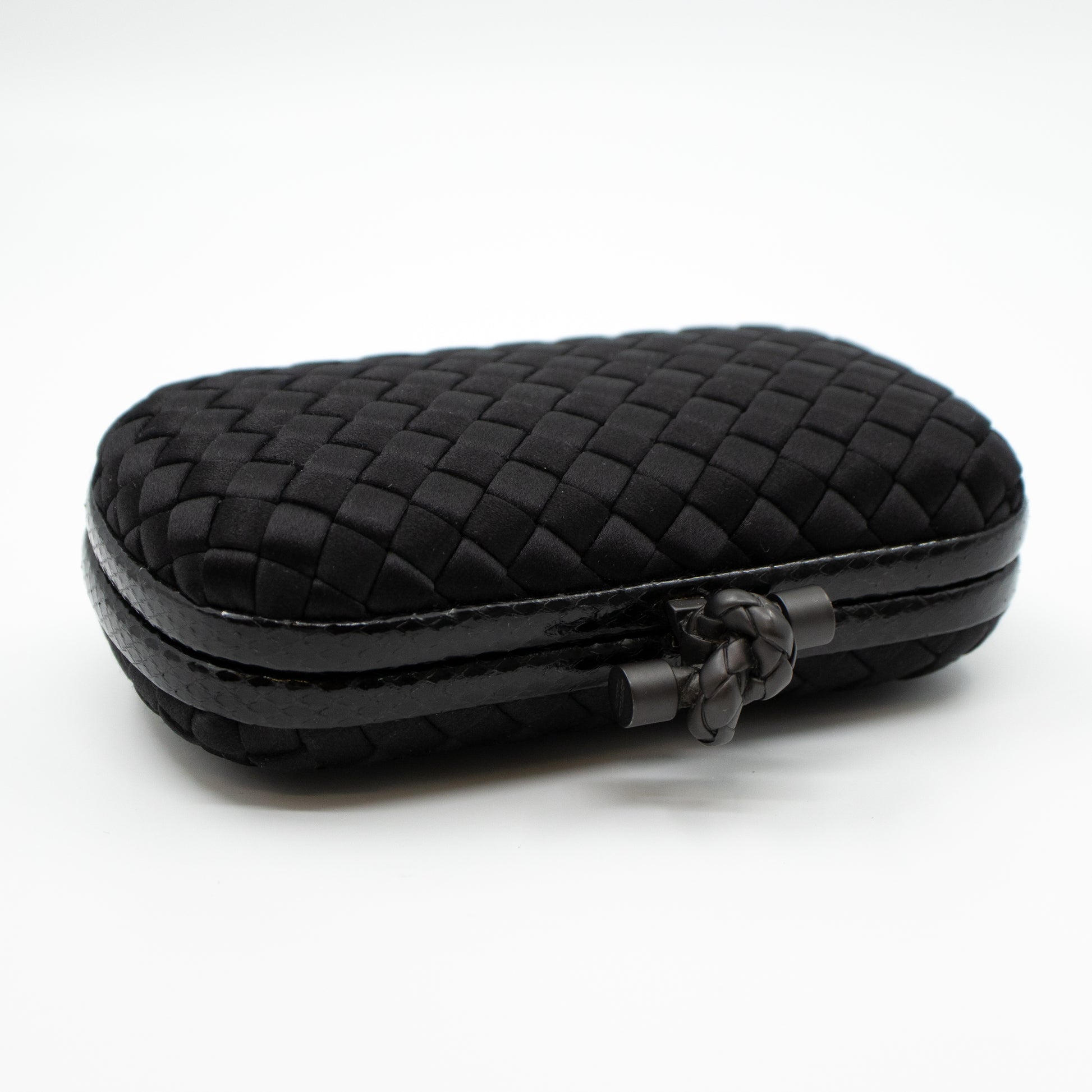 BOTTEGA VENETA, Knot bag, clutch, black braided satin and snake-embossed  leather, rigid model with top fastening in the form of a knot. inside  marked BOTTEGA VENETA MADE IN ITALY. Vintage Clothing 